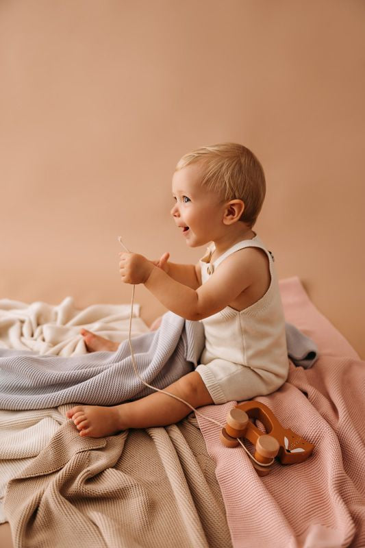 Short knitted baby romper in organic cotton - Jakopina